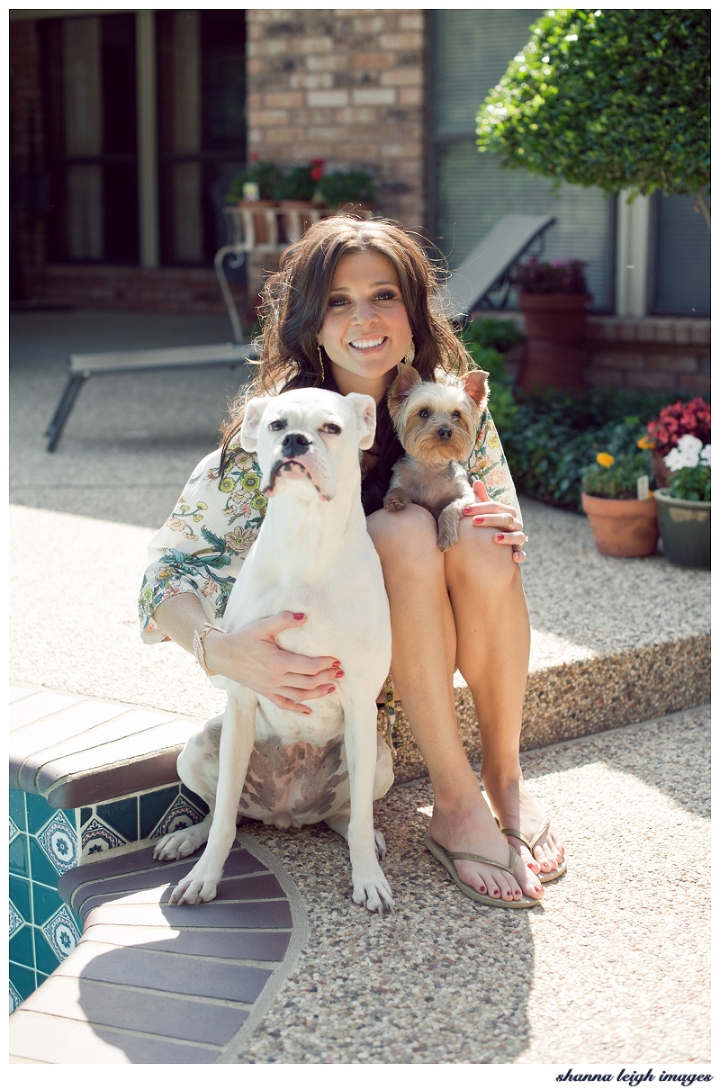 A bride in her pretty plum sugar robe and her two dogs on her wedding day.