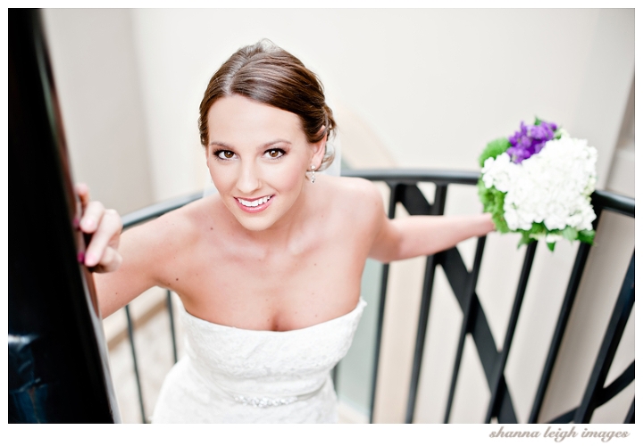 Jennifer posing for her bridal portraits at her gorgeous mediterranean style wedding venue, the Piazza in the Village in Colleyville, Texas.