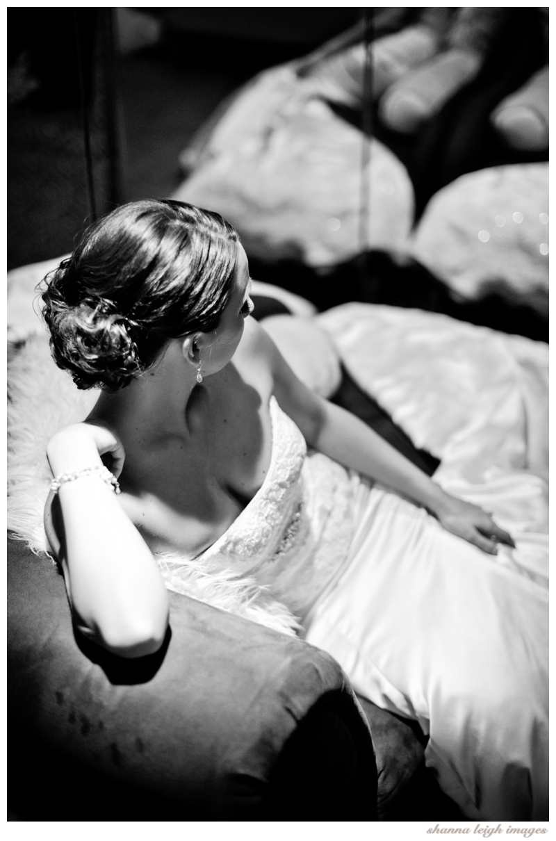 Jennifer posing for her bridal portraits on the chaise lounge at her gorgeous mediterranean style wedding venue, the Piazza in the Village in Colleyville, Texas.