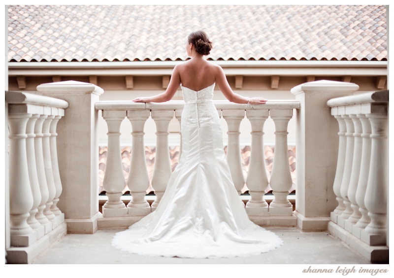 Jennifer posing on the balcony for her bridal portraits at her gorgeous mediterranean style wedding venue, the Piazza in the Village in Colleyville, Texas.