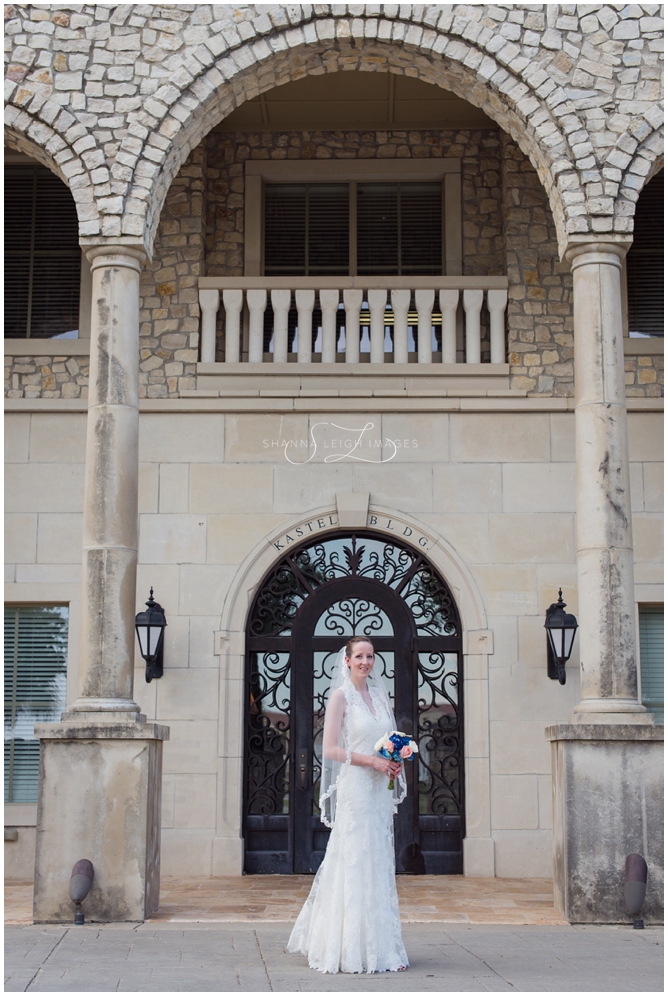 Stephanie in her lace Allure bridal gown posing for her bridal portraits at Adriatica in McKinney, Texas.