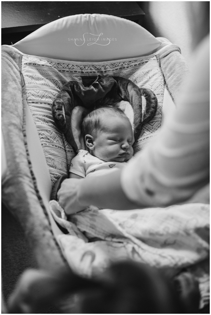 A sweet in home lifestyle newborn session for a brand new family of four by Shanna Leigh Images.