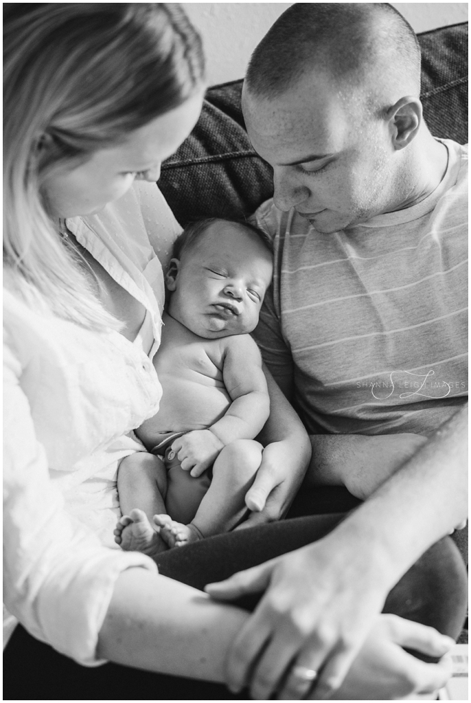 A sweet in home lifestyle newborn session for a brand new family of four by Shanna Leigh Images.