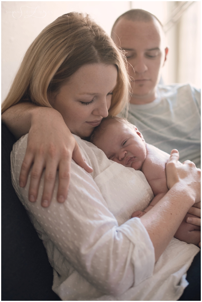 A sweet in home lifestyle newborn session for a brand new family of four by Shanna Leigh Images.