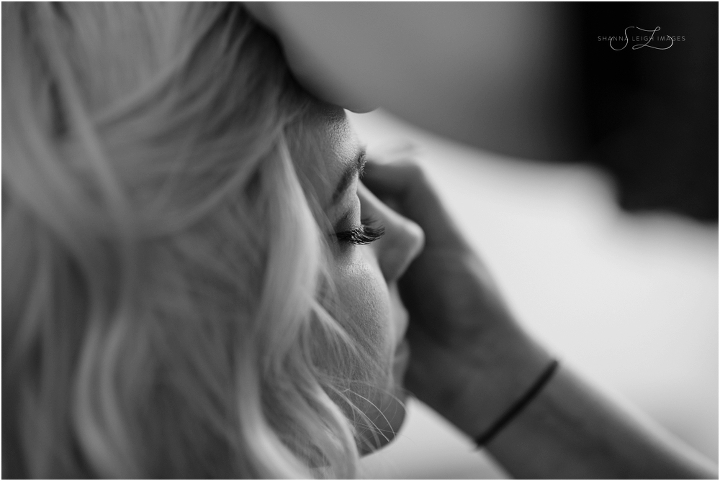 Rachel getting her wedding day makeup applied for her gorgeous outdoor wedding at the Japanese Gardens at the Fort Worth Botanical Gardens.