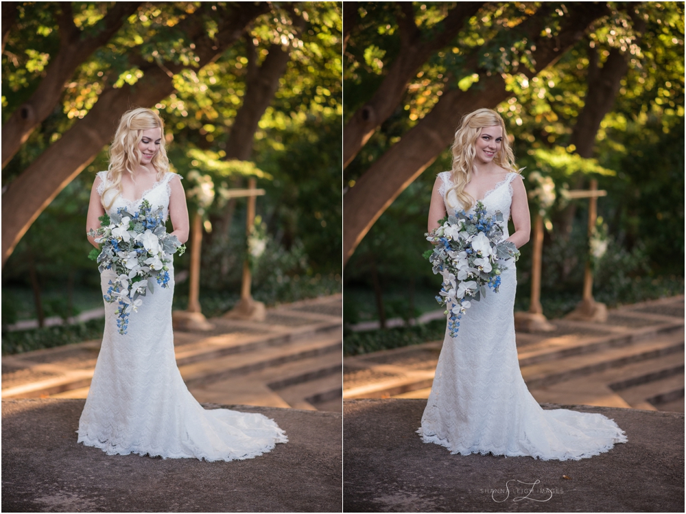 Rachel in her lace backless Robert Bullock wedding dress from Stardust Celebrations with her cascading bouquet of orchids and succulents for her gorgeous outdoor wedding at the Japanese Gardens at the Fort Worth Botanical Gardens.