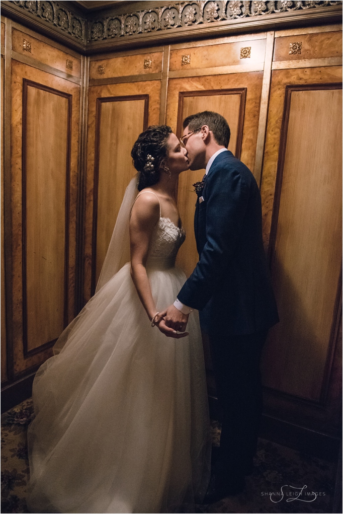 Bride and groom kissing in the elevator at the Historic 512 in Fort Worth, Tx.