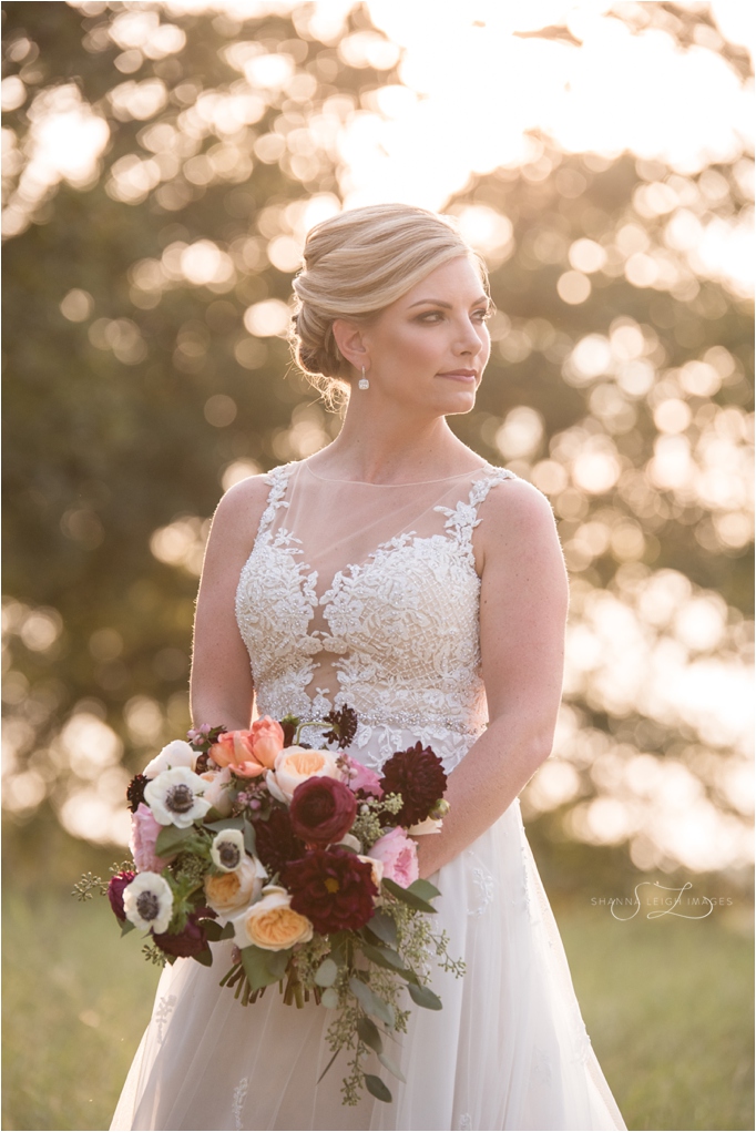 Lauren's gorgeous sunlit bridal portraits in her ivory Maggie Sottero Avery gown.