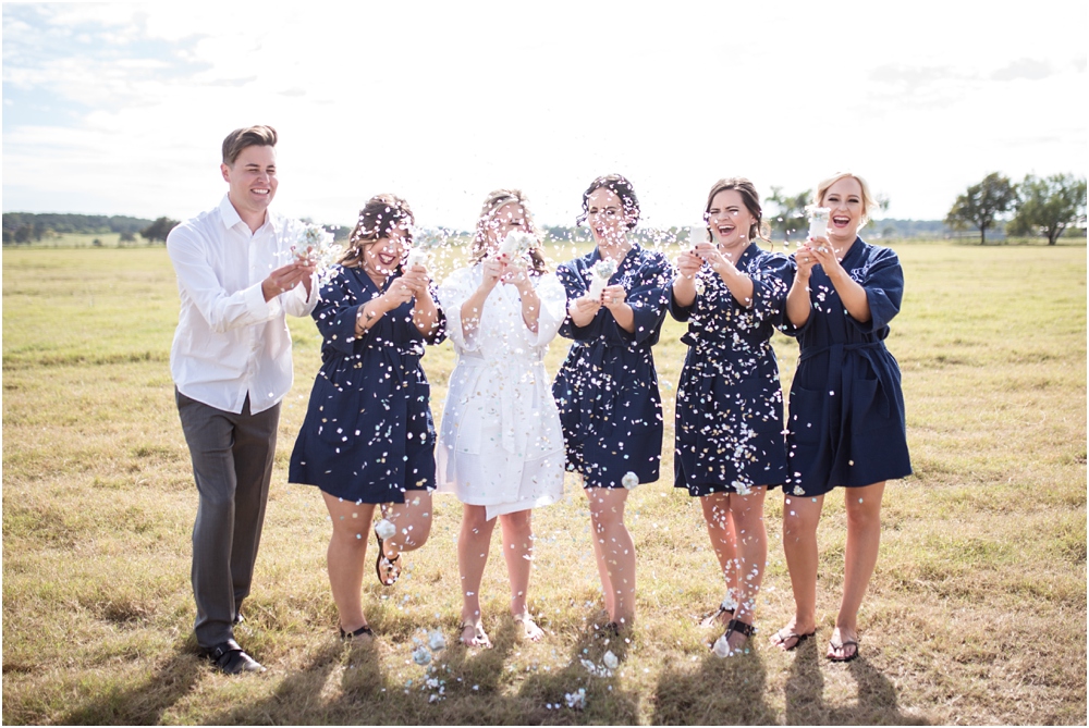 A toast to the bride with confetti pops!